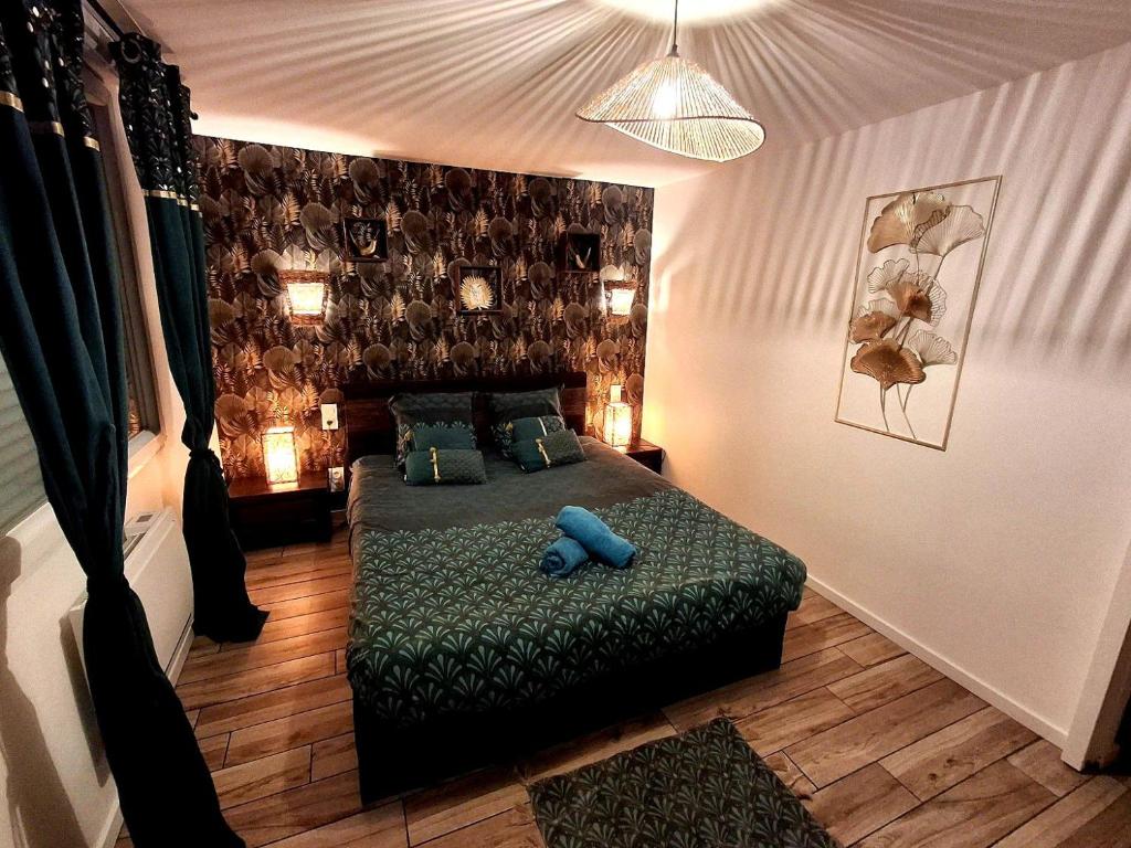 Postel nebo postele na pokoji v ubytování Le 421, Maison d'hôtes Jacuzzi entre amis,familles