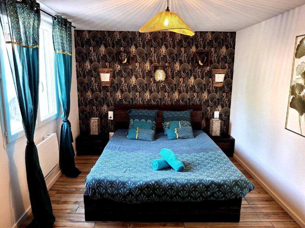 Postel nebo postele na pokoji v ubytování Le 421, Maison d'hôtes Jacuzzi entre amis,familles