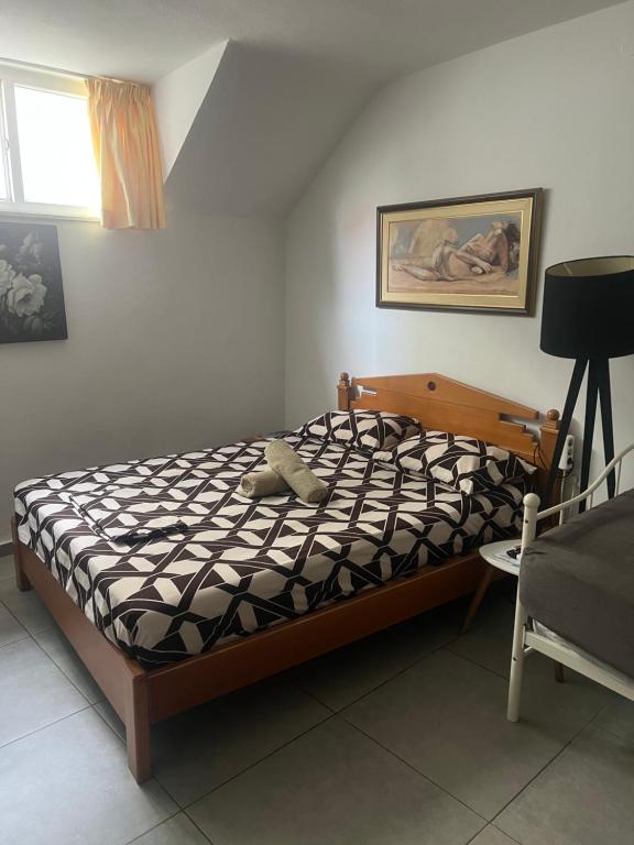 A bed or beds in a room at Centrally Located Private Rooms