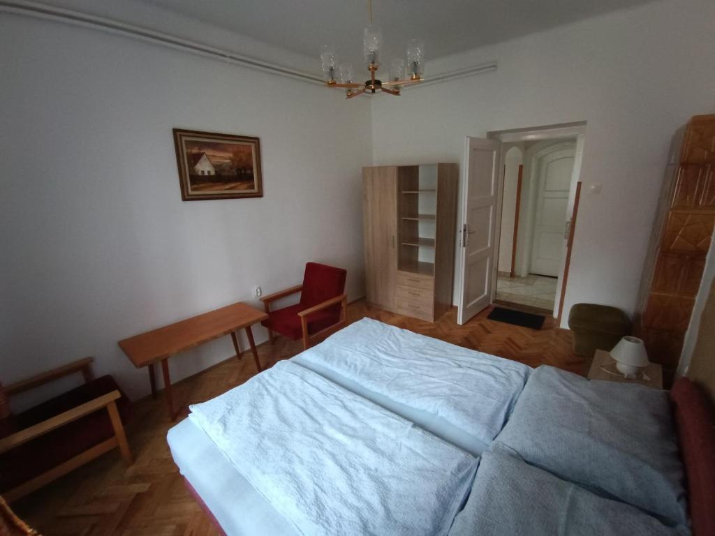 Postel nebo postele na pokoji v ubytování Hétházpuszta Erdészlak
