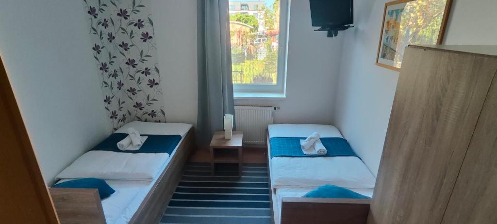 Postel nebo postele na pokoji v ubytování Hotel Orlan