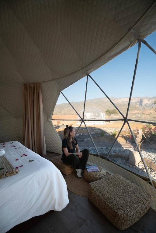 Postel nebo postele na pokoji v ubytování Jabal shams domes