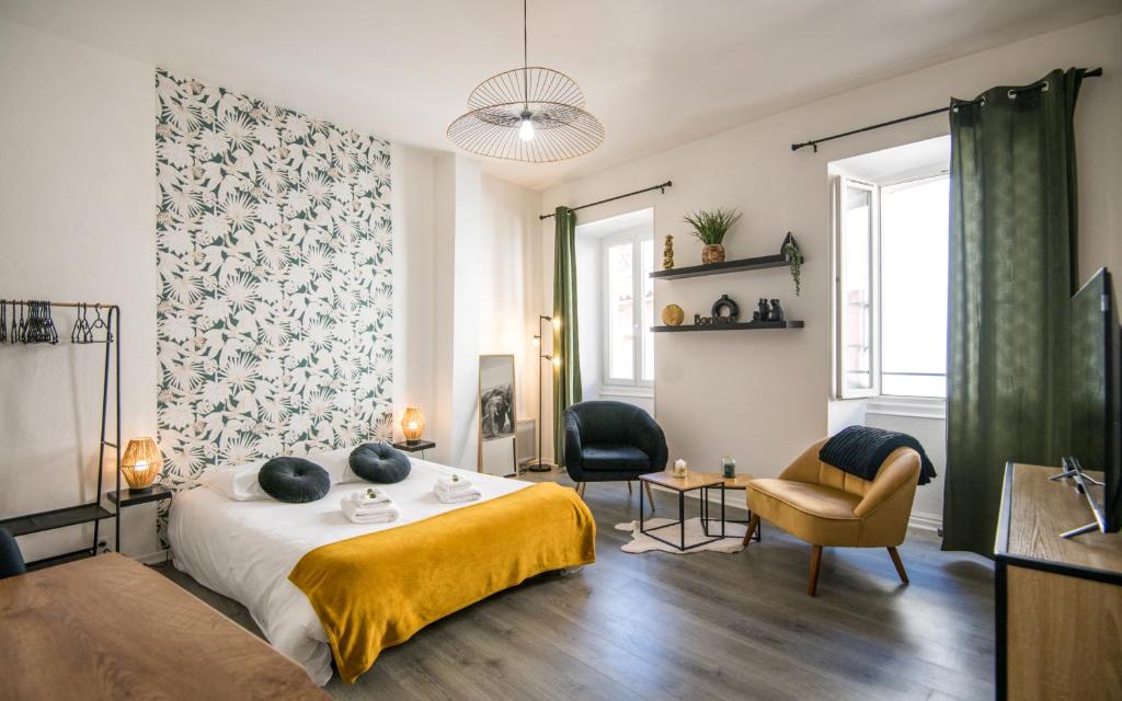 En eller flere senge i et værelse på Cap jungle 2pers Centre-ville fibre