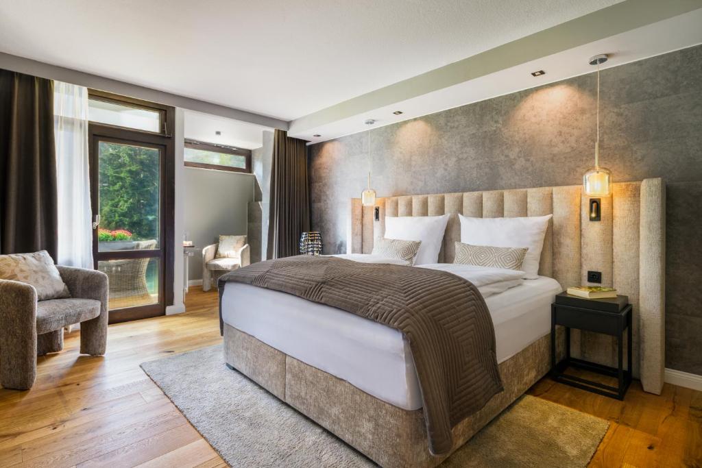 Postel nebo postele na pokoji v ubytování Hotel Luisenpark