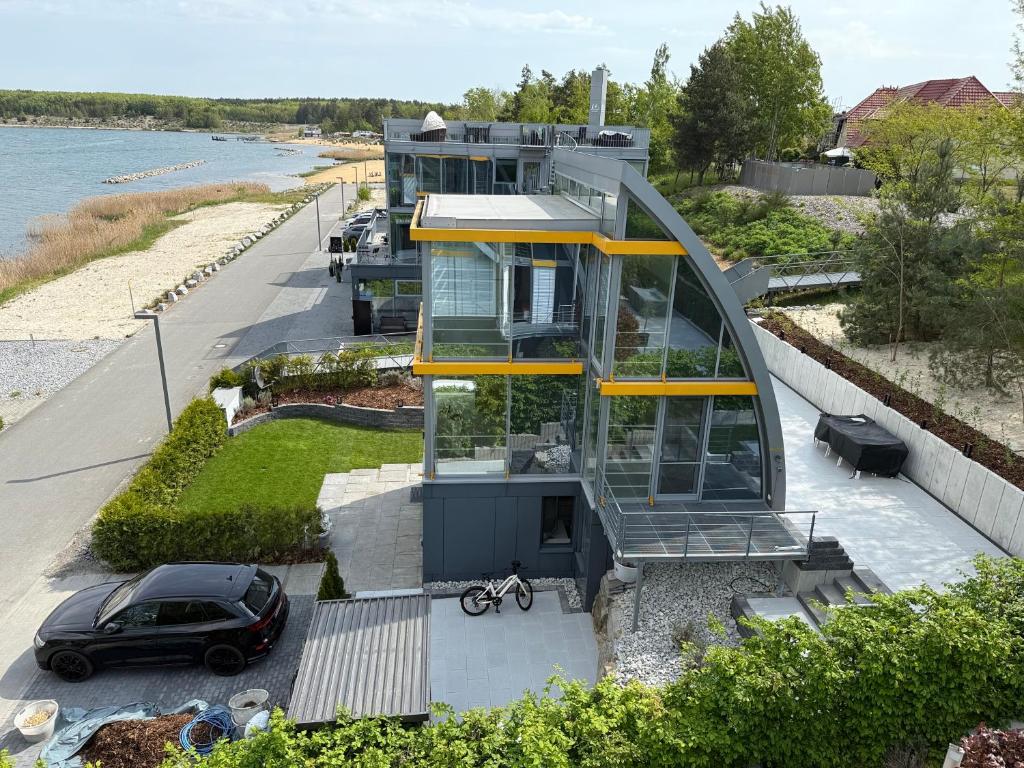 a house with a car parked in front of it at Ferienhaus Lakoma in Elsterheide