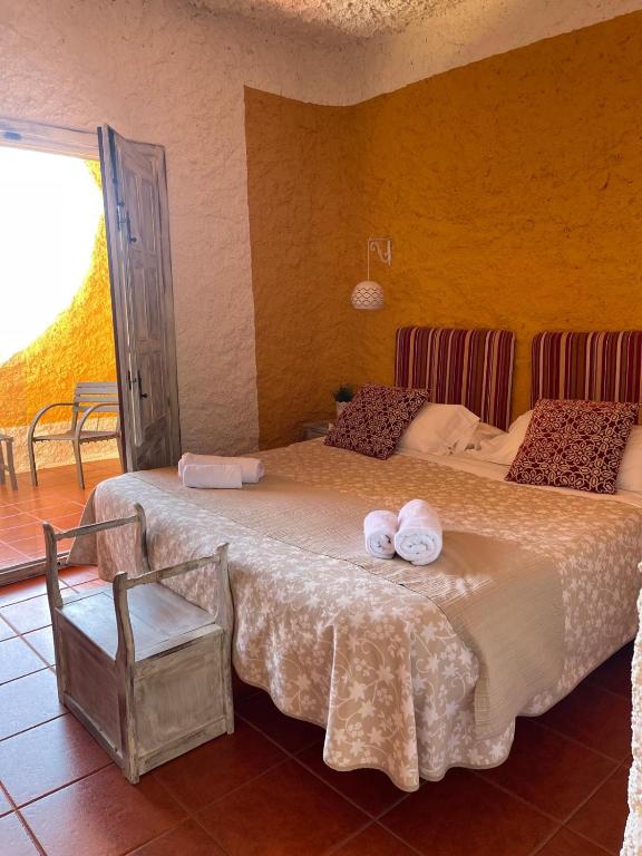 Cama o camas de una habitación en Hotel Rural los Caracoles