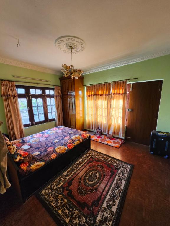 Postel nebo postele na pokoji v ubytování Yadav Niwas Homestay