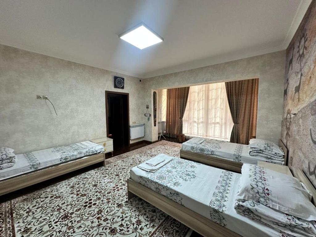 Postel nebo postele na pokoji v ubytování Sultan Saray