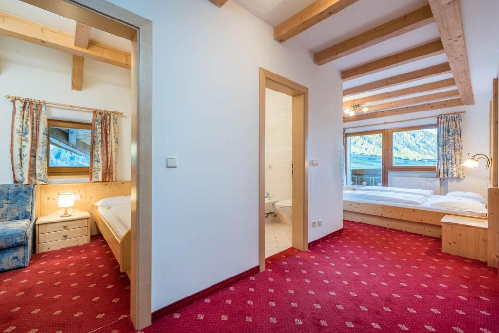 Postel nebo postele na pokoji v ubytování Hotel Kaserhof