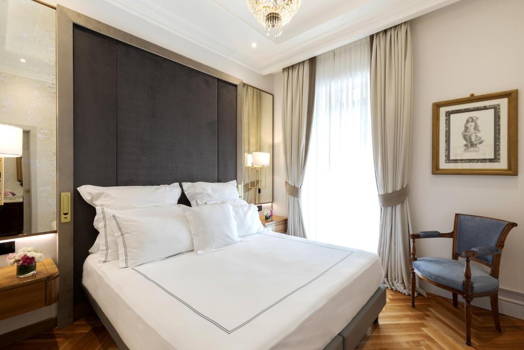 Postel nebo postele na pokoji v ubytování Grand Hotel Parker's
