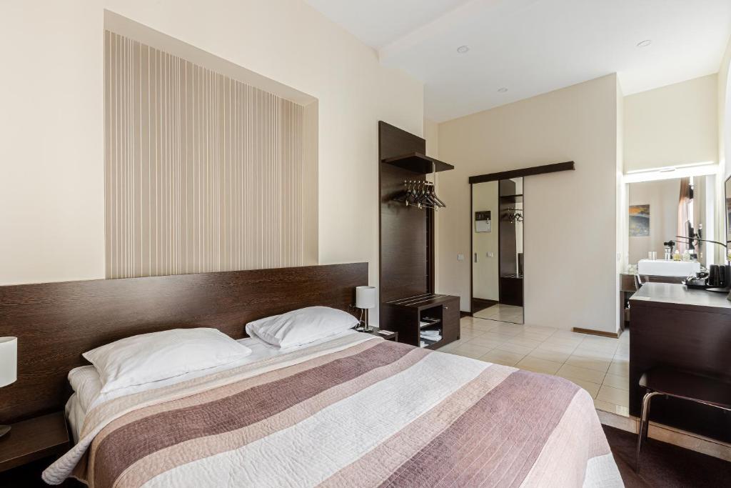 Postel nebo postele na pokoji v ubytování Incognito Boutique Hotel
