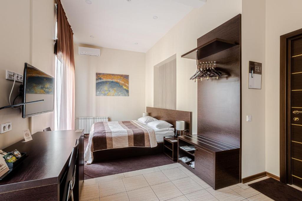 Postel nebo postele na pokoji v ubytování Incognito Boutique Hotel