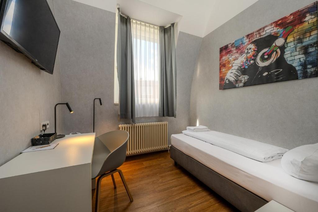 Postel nebo postele na pokoji v ubytování mk hotel berlin