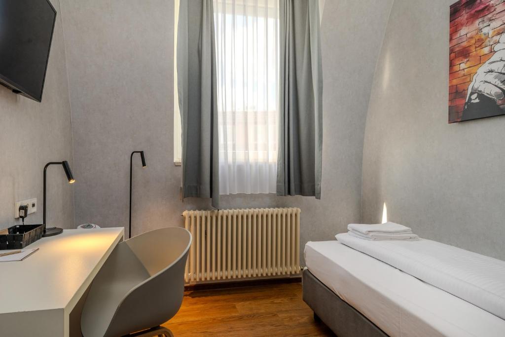 Postel nebo postele na pokoji v ubytování mk hotel berlin