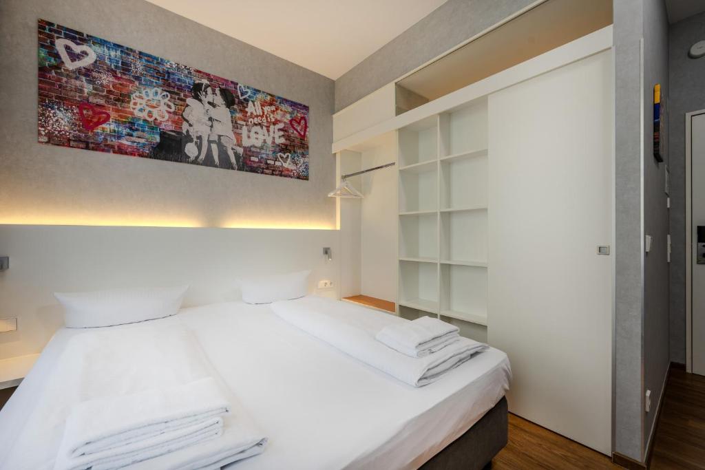 Postel nebo postele na pokoji v ubytování mk hotel berlin