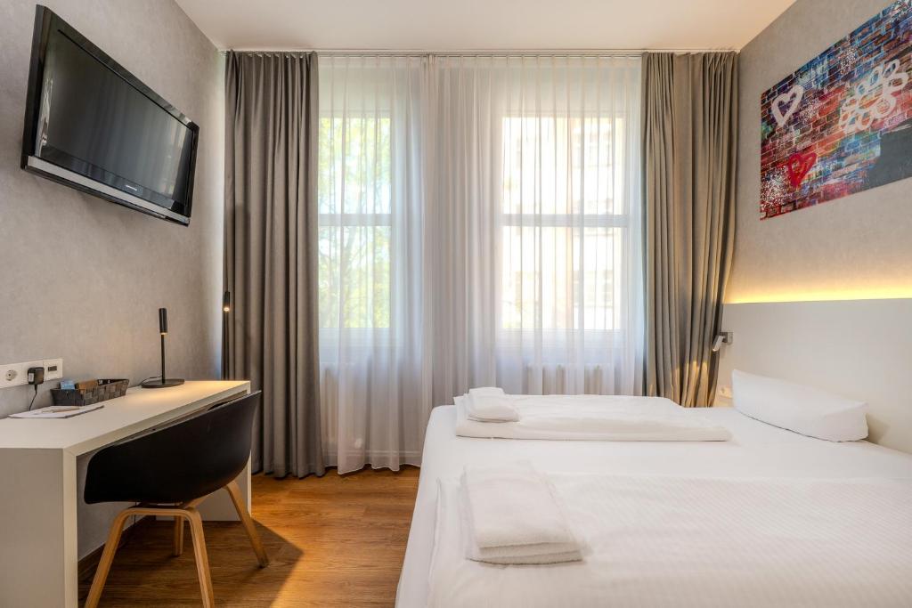 Postel nebo postele na pokoji v ubytování mk hotel berlin