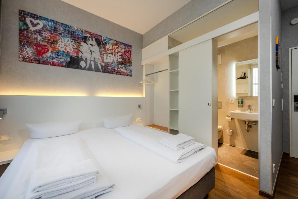 Postel nebo postele na pokoji v ubytování mk hotel berlin