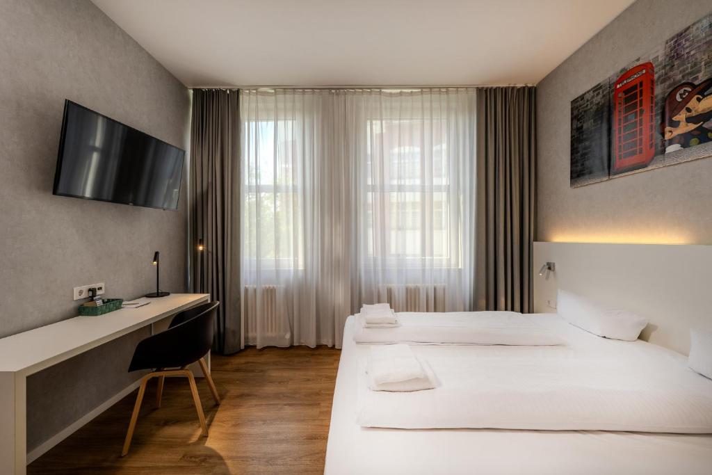 Postel nebo postele na pokoji v ubytování mk hotel berlin