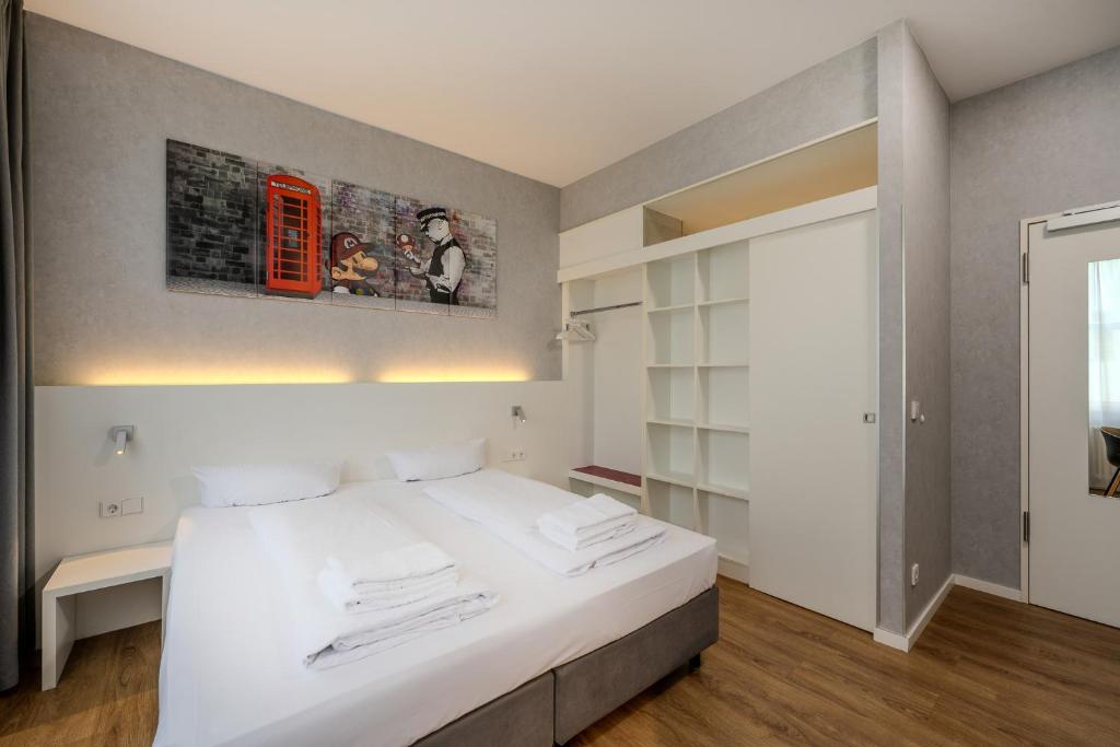 Postel nebo postele na pokoji v ubytování mk hotel berlin