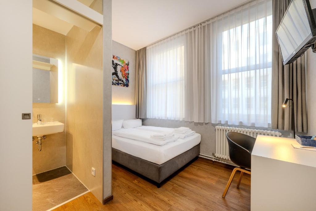 Postel nebo postele na pokoji v ubytování mk hotel berlin