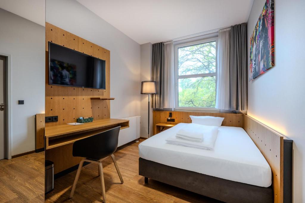 Postel nebo postele na pokoji v ubytování mk hotel berlin