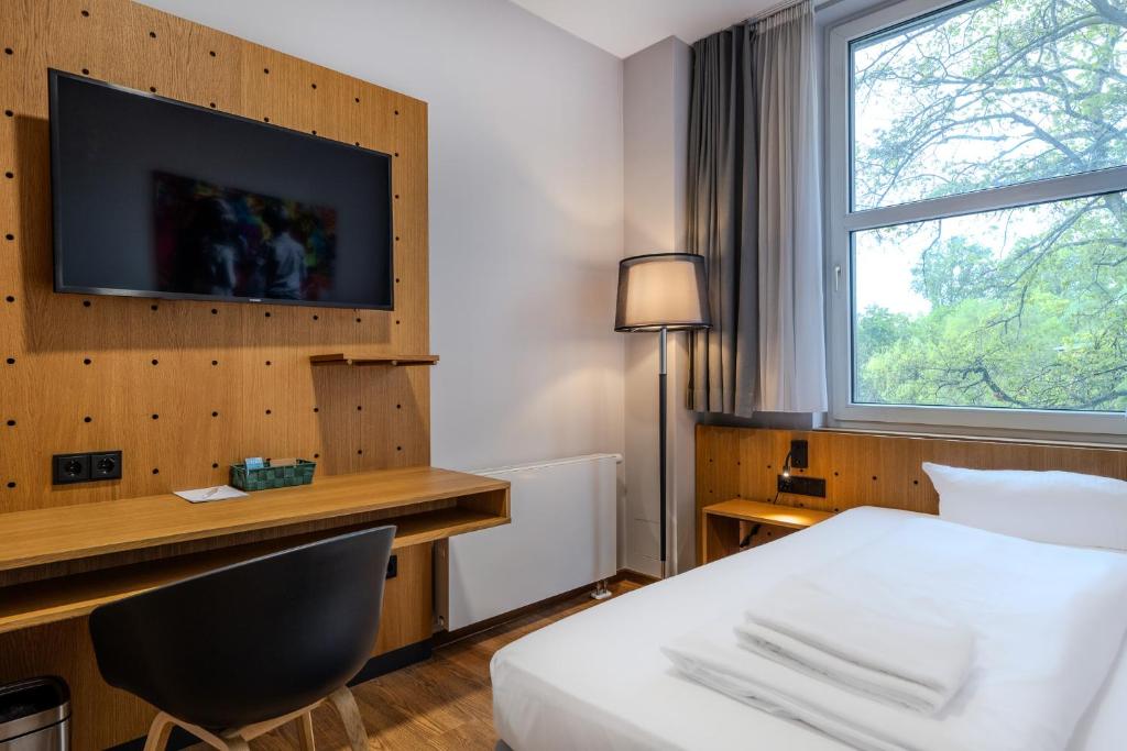 Postel nebo postele na pokoji v ubytování mk hotel berlin