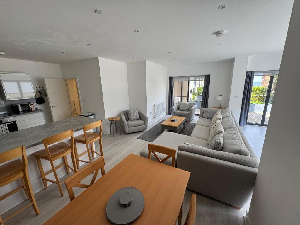 a living room with a couch and a table at 10 Argyle Court in Whitby