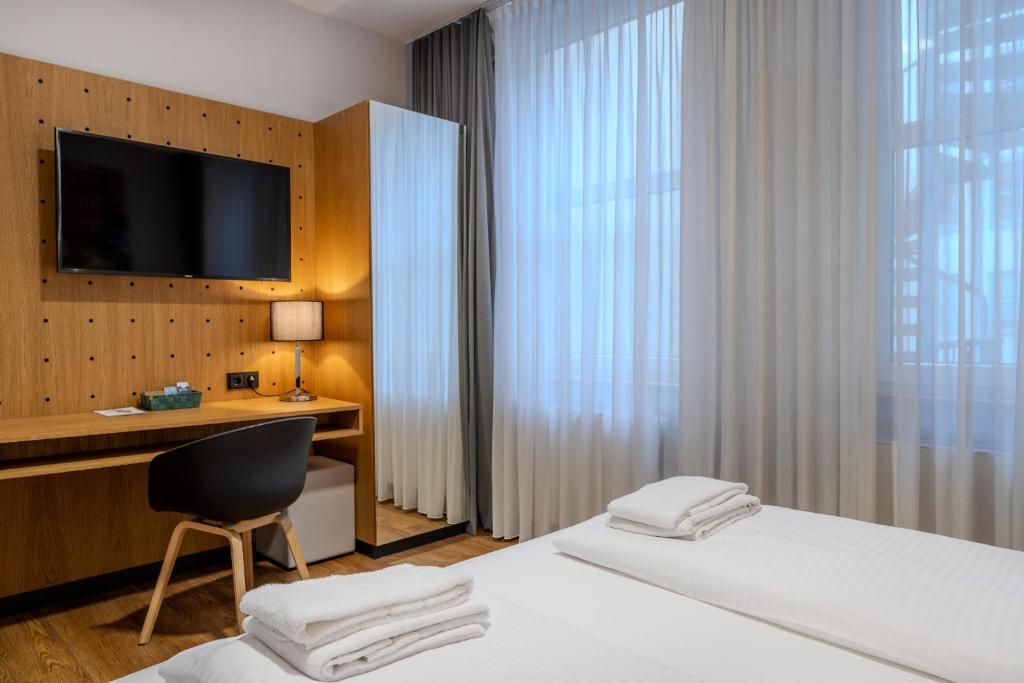 Postel nebo postele na pokoji v ubytování mk hotel berlin