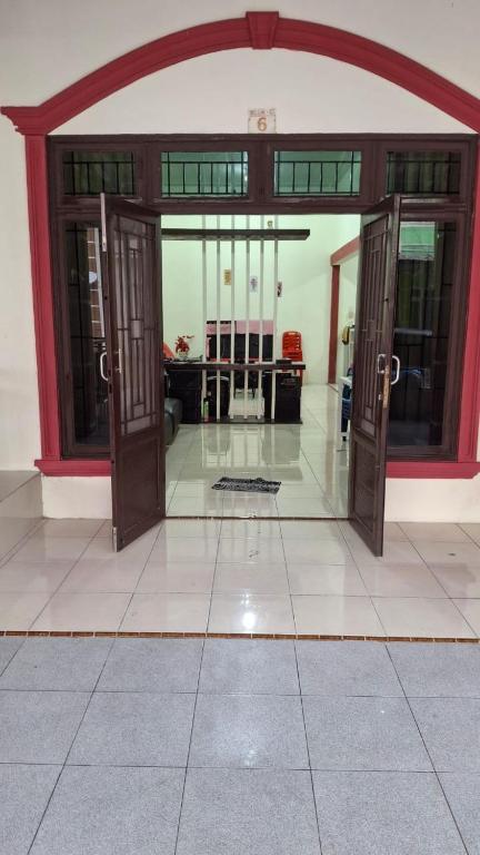 an open door of a building with a lobby at Villa gunung mas c6 in Berastagi
