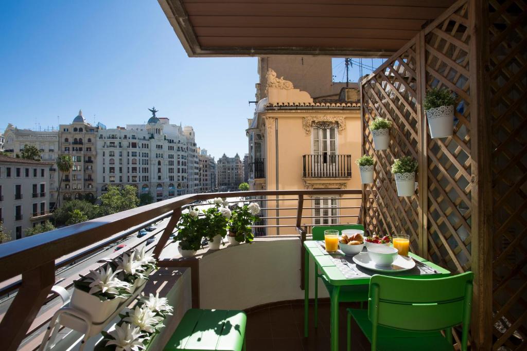 a balcony with a table and chairs on a balcony at Xativa Terrace II in Valencia