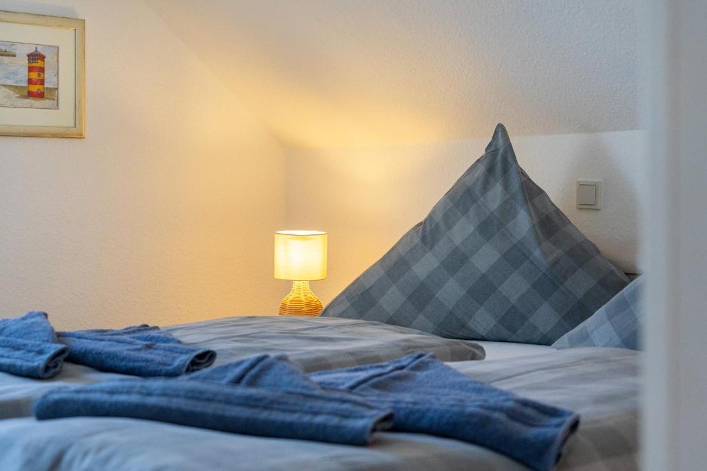 Postel nebo postele na pokoji v ubytování Fischhuus