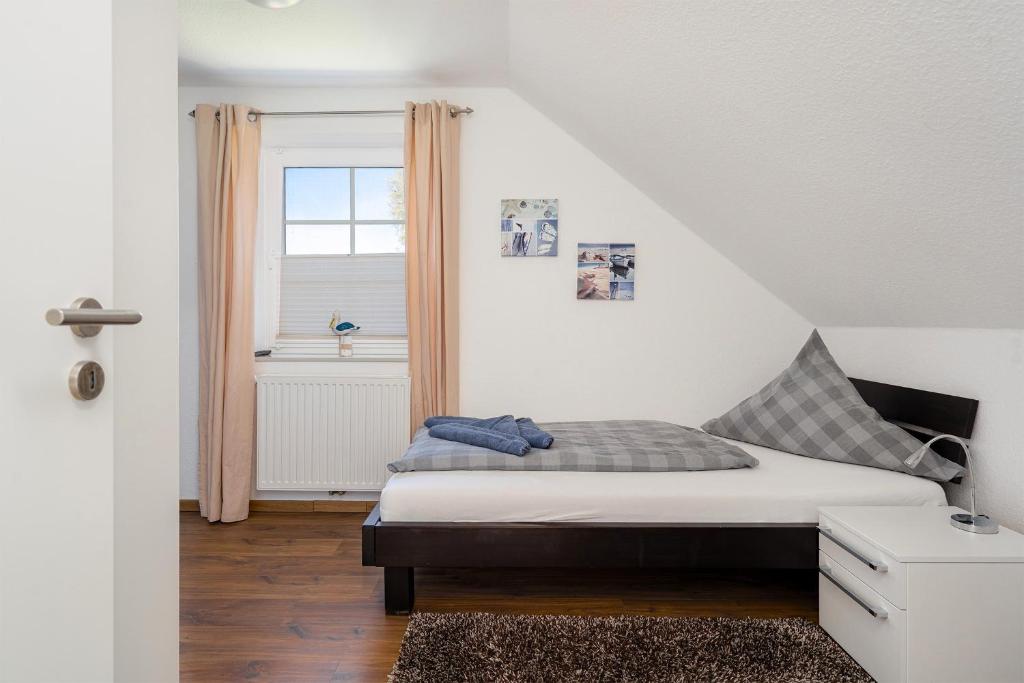 Postel nebo postele na pokoji v ubytování Fischhuus