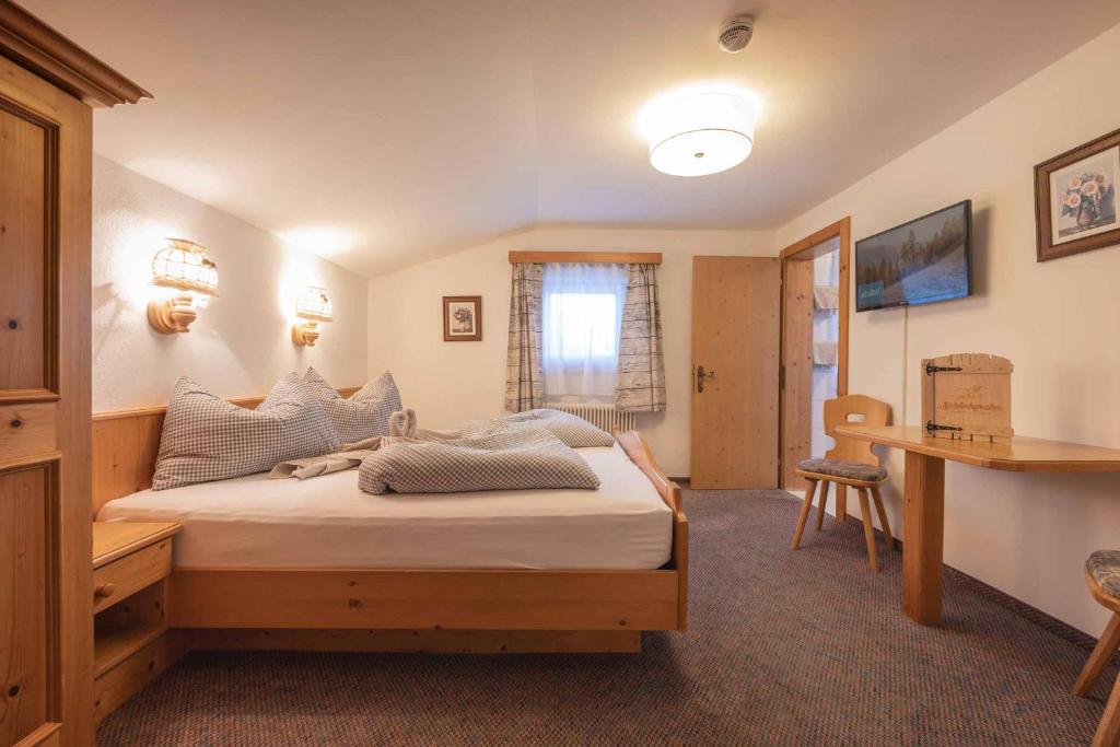 Postel nebo postele na pokoji v ubytování Die Schlickeralm