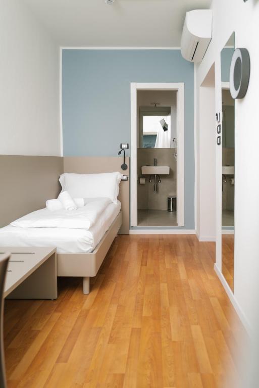 Postel nebo postele na pokoji v ubytování Ventus Park Hotel