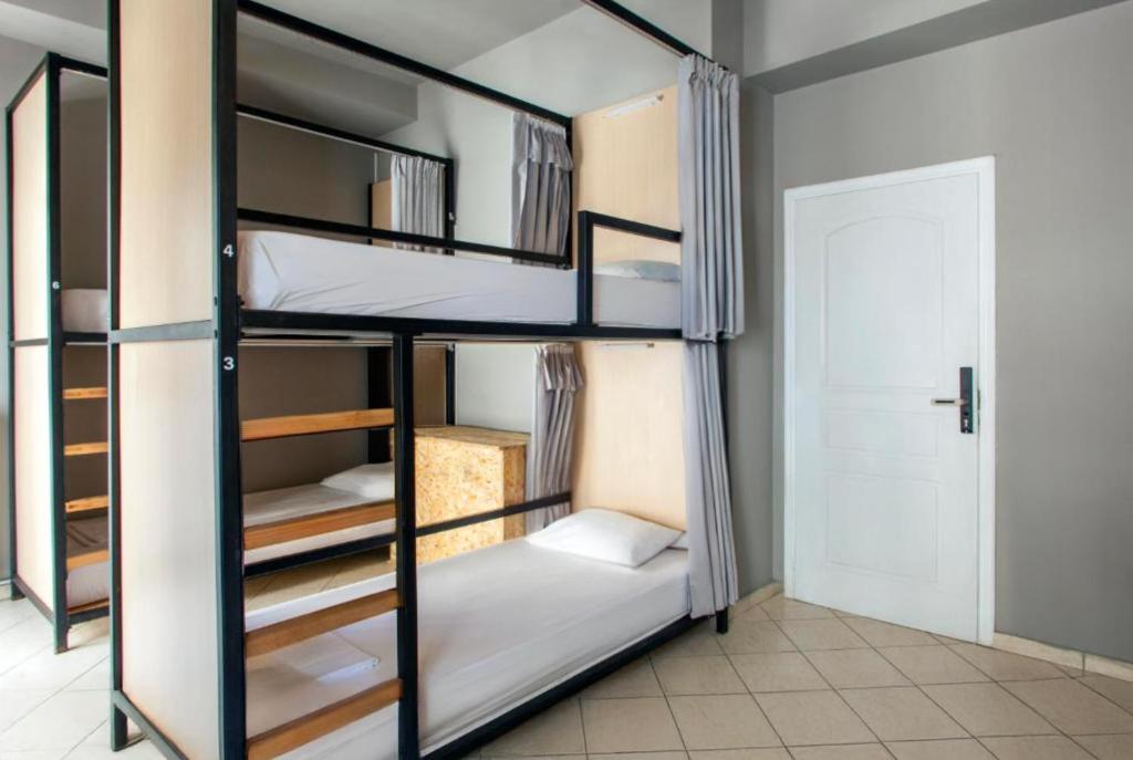 Postel nebo postele na pokoji v ubytování So Young Hostel