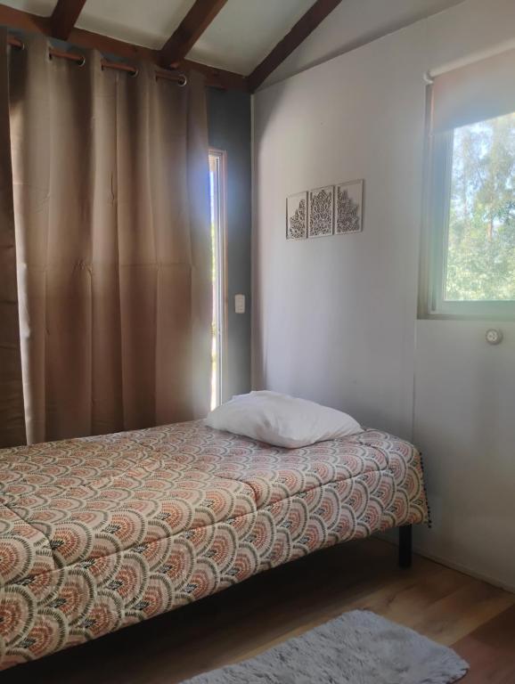 Postel nebo postele na pokoji v ubytování Cabaña Mirador