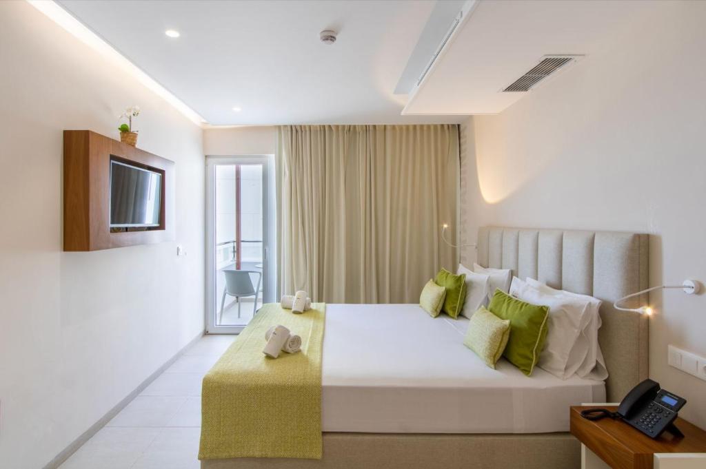 Postel nebo postele na pokoji v ubytování Luna Boutique Hotel