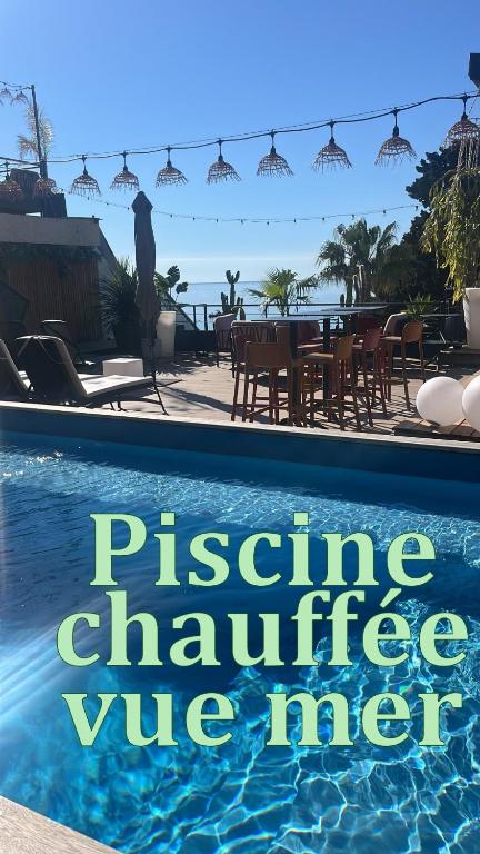 a sign that reads passive challenge wire meta next to a swimming pool at Les Alcyons in Le Lavandou