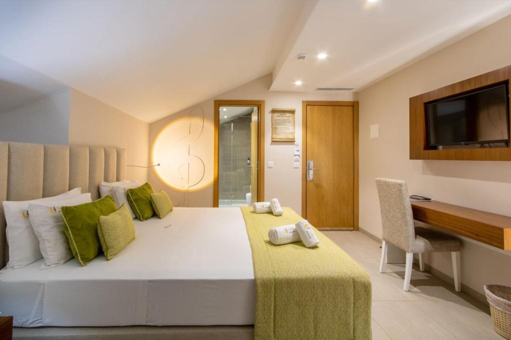 Postel nebo postele na pokoji v ubytování Luna Boutique Hotel