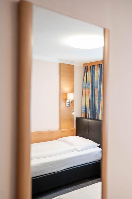 Postel nebo postele na pokoji v ubytování Hotel Ganslhof - Adults only