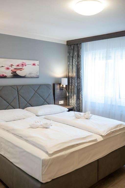 Postel nebo postele na pokoji v ubytování Hotel Ganslhof - Adults only