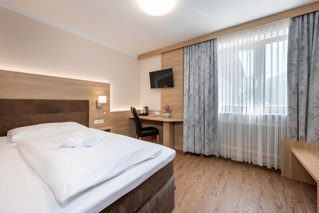 Postel nebo postele na pokoji v ubytování Hotel Ganslhof - Adults only