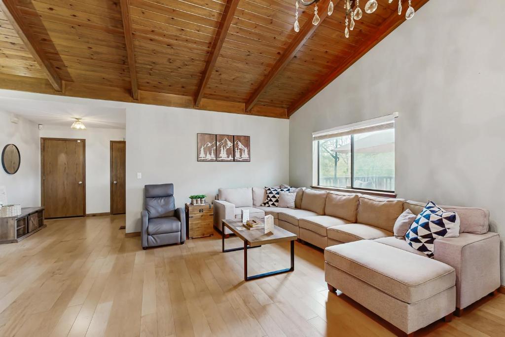 a living room with a couch and a table at Harmony Haven in Groveland