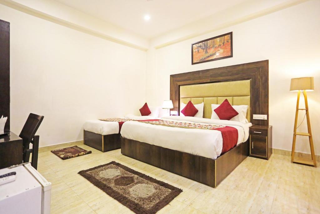 Postel nebo postele na pokoji v ubytování Airport Hotel Kiara - New Delhi Airport