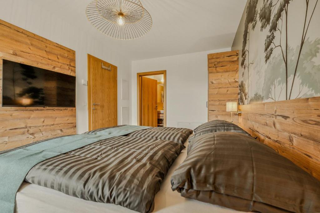 Postel nebo postele na pokoji v ubytování Design-Apartment Katschi - Entspannung auf 1641m Höhe