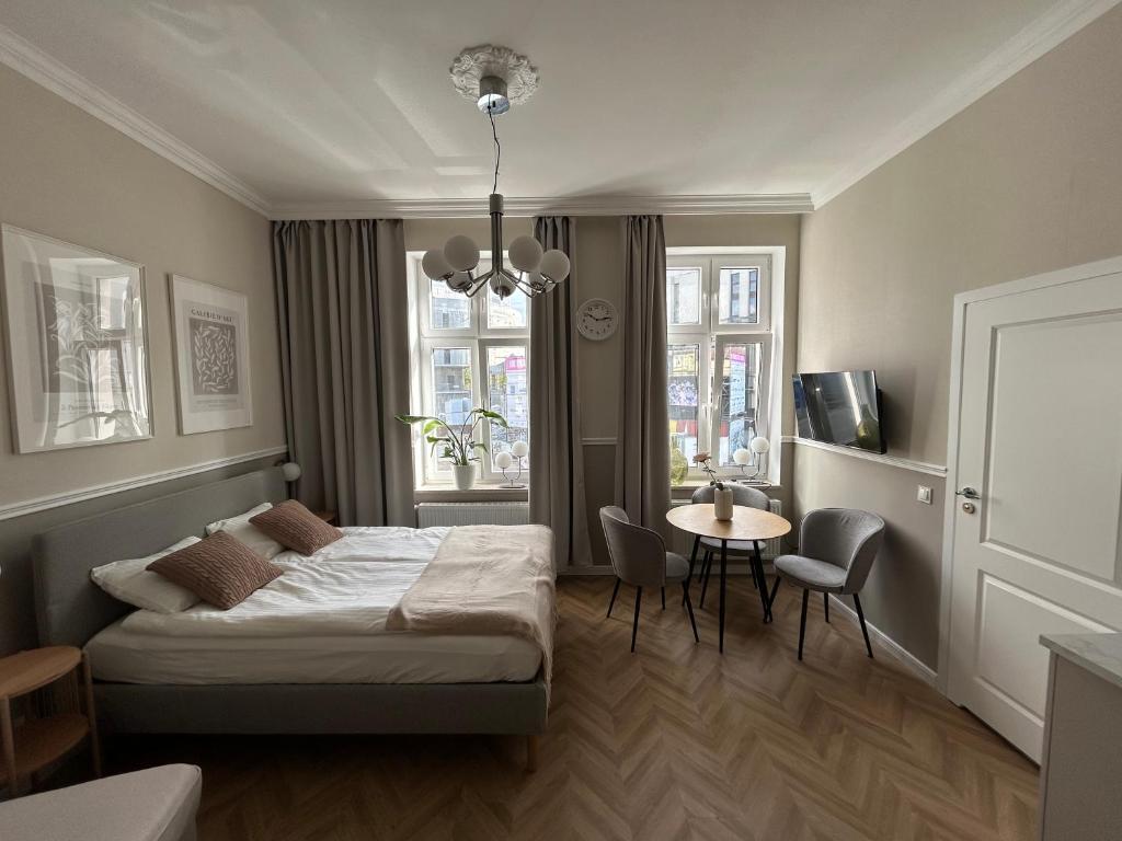 Ένα ή περισσότερα κρεβάτια σε δωμάτιο στο Apartament Przy Operze