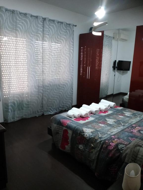 A bed or beds in a room at La Pinetina Roma