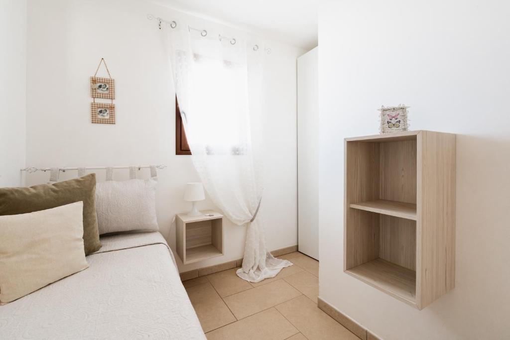 Postel nebo postele na pokoji v ubytování Appartamento Pineta Mare