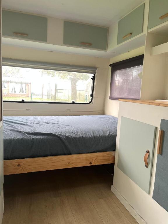 Postel nebo postele na pokoji v ubytování Glamping 't Hoveke
