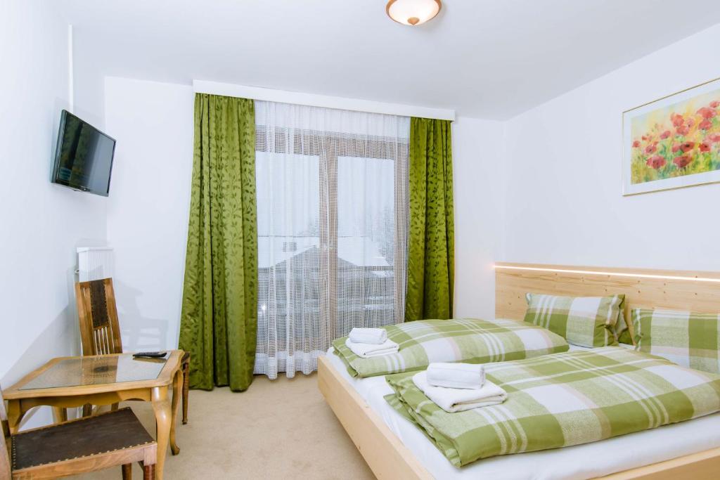 Posteľ alebo postele v izbe v ubytovaní Apartmenthaus Kuchelberg